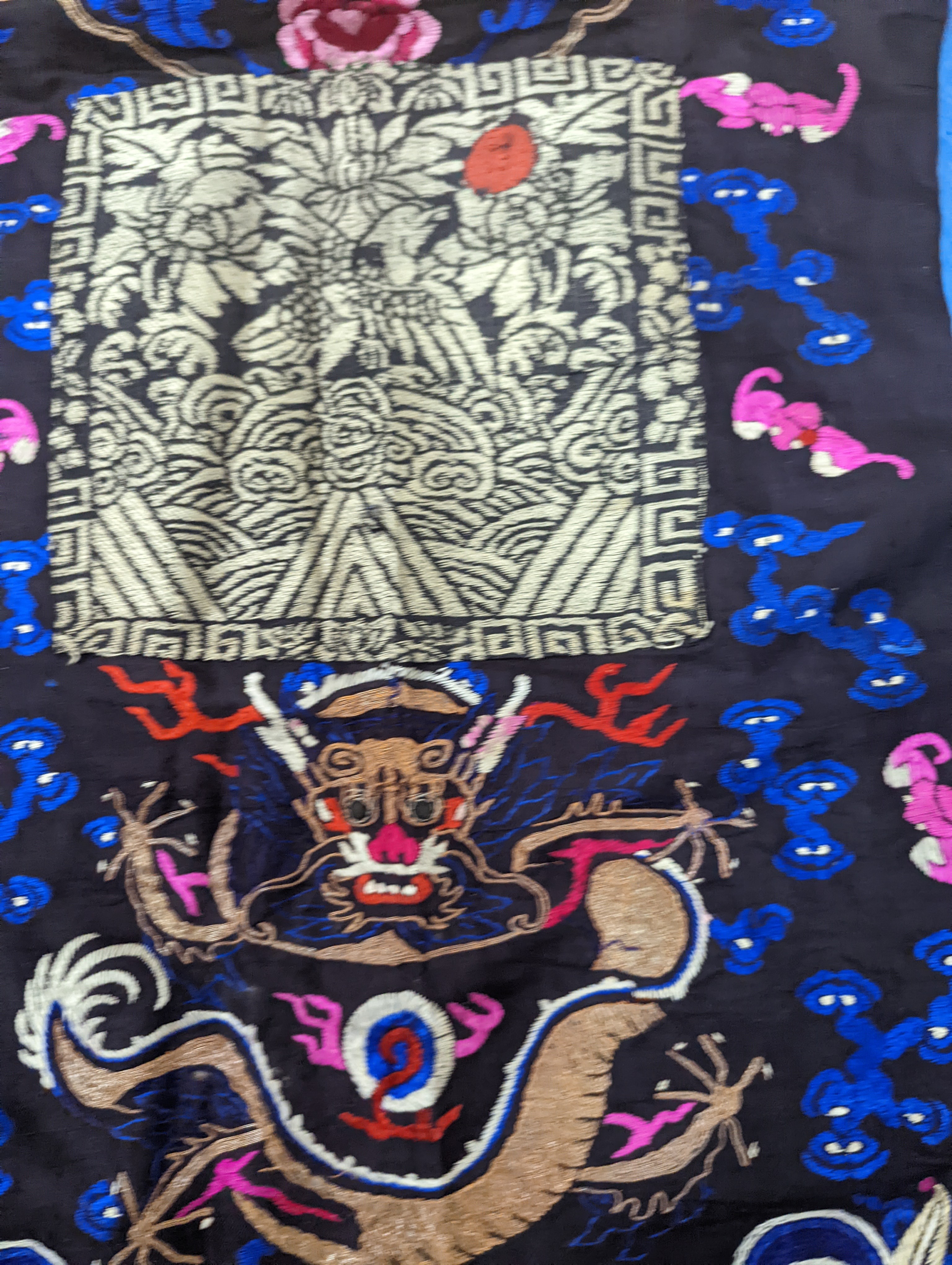 A 1920's Chinese dragon embroidered waistcoat, a cream silk drawn thread dress and a silk crepe black and patterned reversible kimono (3 items).